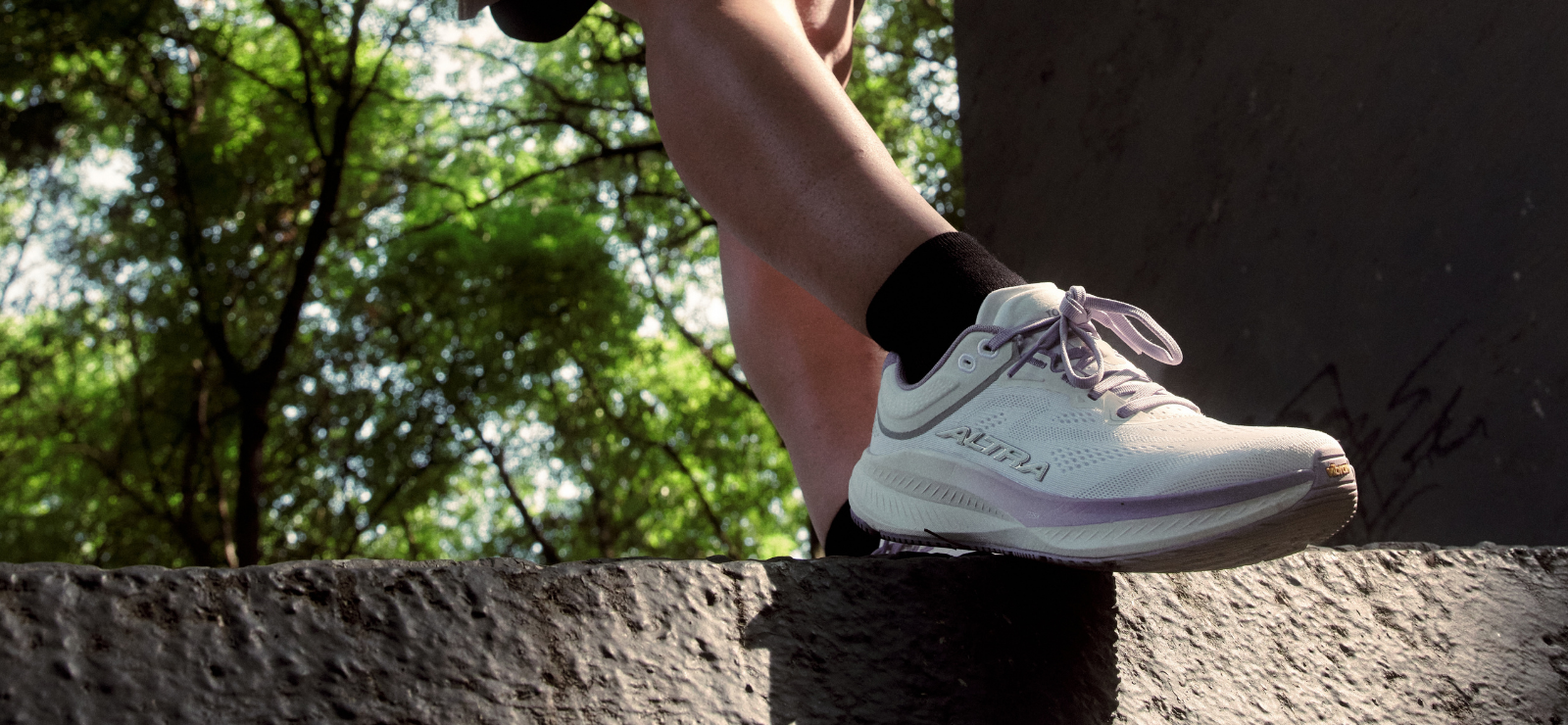 woman standing in Altra shoe